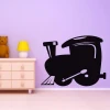 Chalk sticker train 208 - Decor for a child\'s room. Purple walls and light-colored furniture.