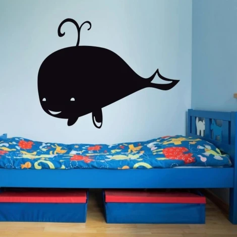 Chalkboard whale sticker 187 - Decor for a child\'s room. Light-colored walls, bed with colorful bedding.