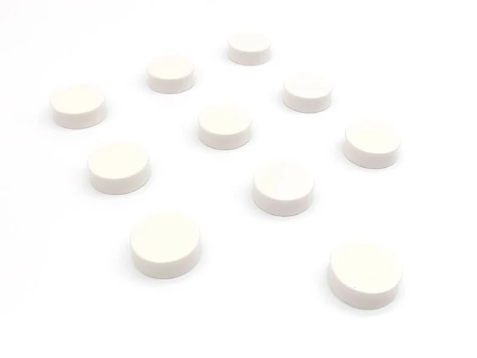 Magnets 34x12.5mm, 10 pieces, various colors - Graphic design. Round shapes evenly spaced on a white background.