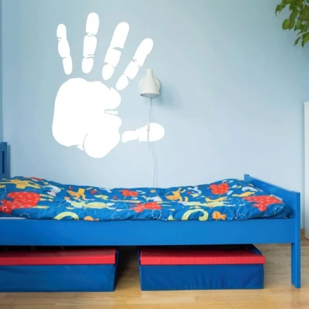 Handprint dry-erase board 196 - Decor in a child\'s room. Light-colored walls, blue bed.