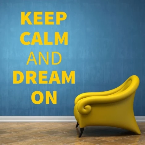 Keep calm and dream on sticker 1946 - Room decor with blue wall and yellow chair in the corner.