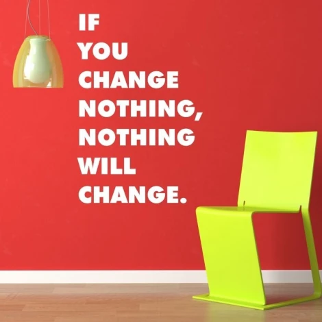 Sticker "If you change nothing 1952" - Room decor with red walls, green chair, and lamp.