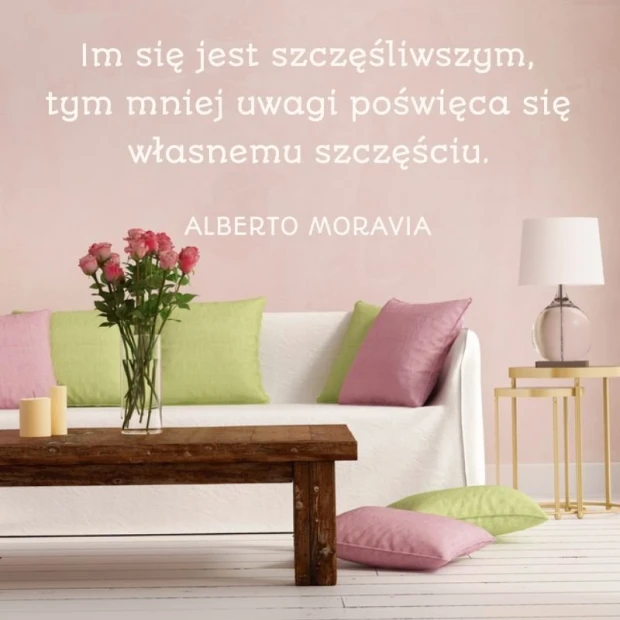 Sticker "Happier Since 1958" - Living room arrangement with light-colored walls and a sofa with assorted cushions.