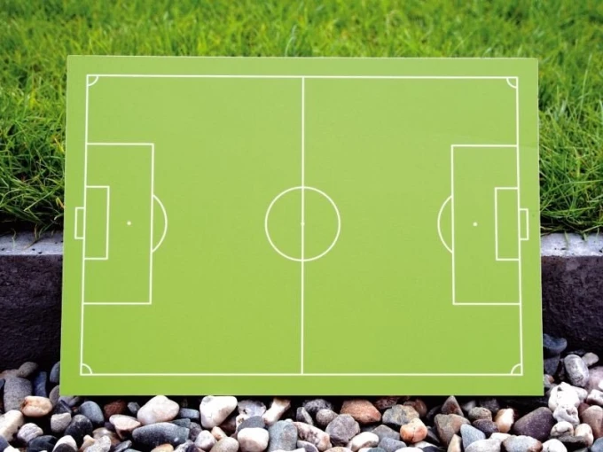 Tactical coaching board 185 for field hockey - dry-erase, green surface with white lines, graphic design.