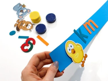 Self-adhesive magnetic strip for magnets, 60 cm - various colors - Graphic design on a blue background with colorful elements.