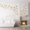 Decorative leaf stickers 1895 - Living room setup with light walls, wooden floor, and fireplace in the background.