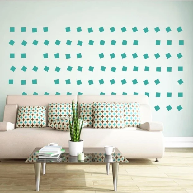 Square stickers set 1995 - Living room arrangement. Light-colored wall, sofa in a light shade with cushions.