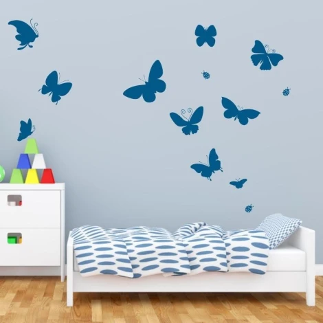 Butterfly stickers set 1887 - Decor in a child\'s room. Light-colored walls, simple style furniture.