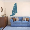 Windsurfing sticker 2041 - Living room setup with light-colored walls and a blue sofa with checkered cushions.