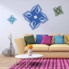 Abstract decorative sticker 2024 - Living room arrangement with light walls, beige sofa, and cushions.