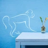 Decorative monkey sticker 2003 - Graphic design. Contoured monkey with clear lines on a blue background.