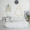 Decorative silhouette sticker 2035 - Bedroom design with light-colored walls and a bed with white bedding.