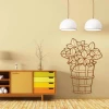 Sticker of a basket and flowers 2050 - Living room decor. Light-colored wall, furniture in shades of brown and yellow.