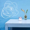Flower sticker 2082 - Room arrangement. Blue wall, table with white legs, vase with a plant on it.