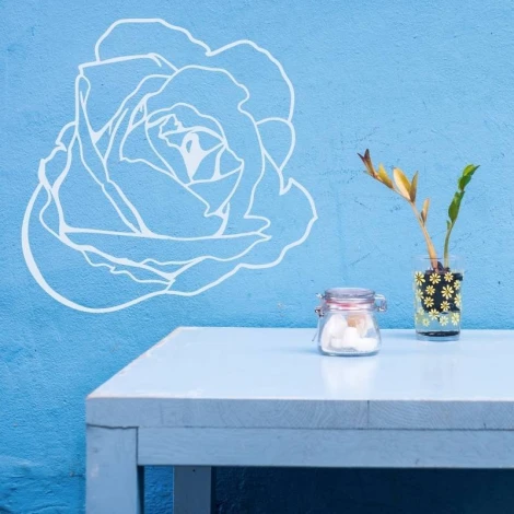 Flower sticker 2082 - Room arrangement. Blue wall, table with white legs, vase with a plant on it.