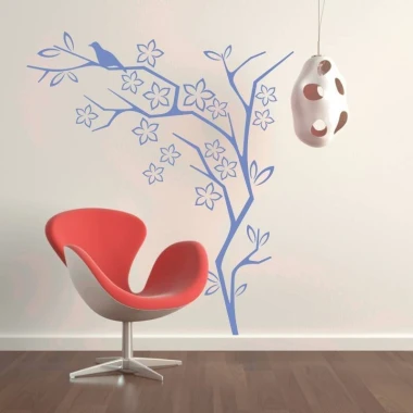 Decorative sticker tree bird 2115 - Living room setup with light walls, wooden floor, and modern chair.