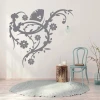 Decorative branch sticker 2123 - Room arrangement with light walls, wooden floor, and blue chair.