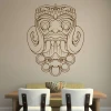 Bali mask wall sticker 2097 - Dining room setup with light-colored walls and a table with light chairs.