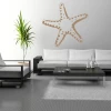 Starfish wall sticker 2105 - Living room decor with light-colored walls and black and white furniture.