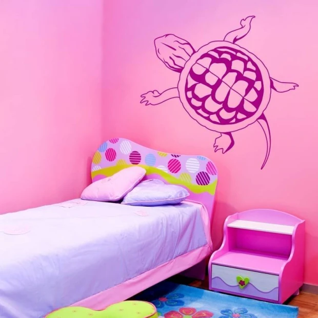 Turtle wall sticker 2107 - Decor for a child\'s room with pink walls and pastel-colored furniture.