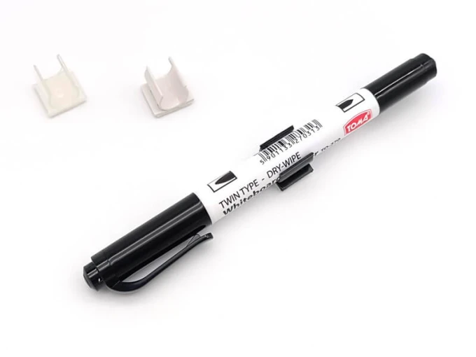 Plastic holder for double-sided marker or pen - Graphic design. Rectangular shape, white, with two.