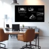 Custom black dry-erase board for marker writing - Office setup with light walls and modern furniture.
