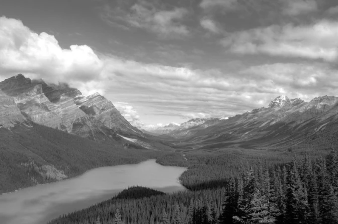 Wall mural of a blue lake in a mountain valley FP 1424 - Graphic design featuring a lake surrounded by mountains.