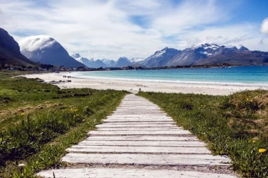 Beautiful wall mural of a scenic road to a lakeside village FP 1398 - Graphic design. A wooden path leads through.