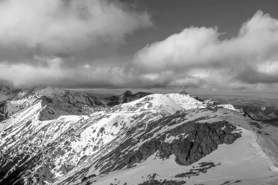 Mountain wall mural Tatras mountain hut FP 1402 - Graphic design. Scenic view of snowy peaks and clouds.