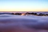 Wall mural of fog rising over the city FP 1517 - Graphic design. Fog softens the city\'s outlines, background visible.