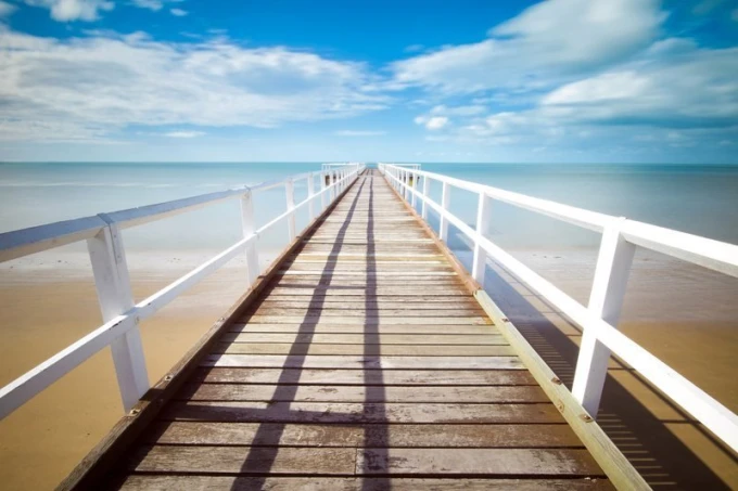 Wall mural of a pier with white railings FP 1632 - Graphic design. Features a visible pier with white barriers.