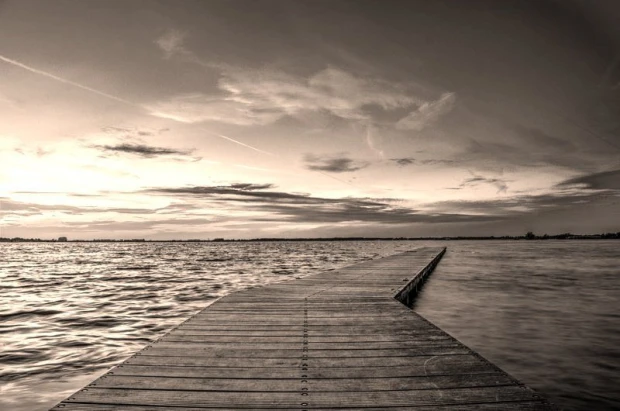 Romantic wall mural FP 1616 - Graphic design of a pier leading to water, surrounded by clouds and horizon.