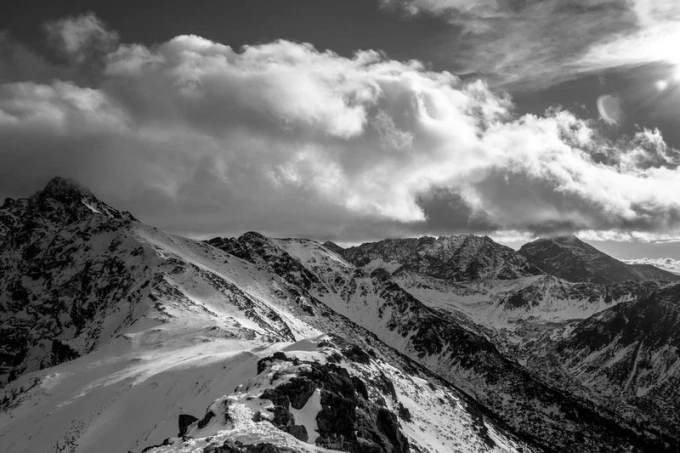 Wall mural of Tatra peaks in winter FP 1626 - Graphic design. Black and white mountains with clouds, sharp edges.