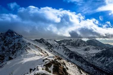 Wall mural of Tatra peaks in winter FP 1626 - Graphic design. Snow-covered mountains with a cloudy sky.