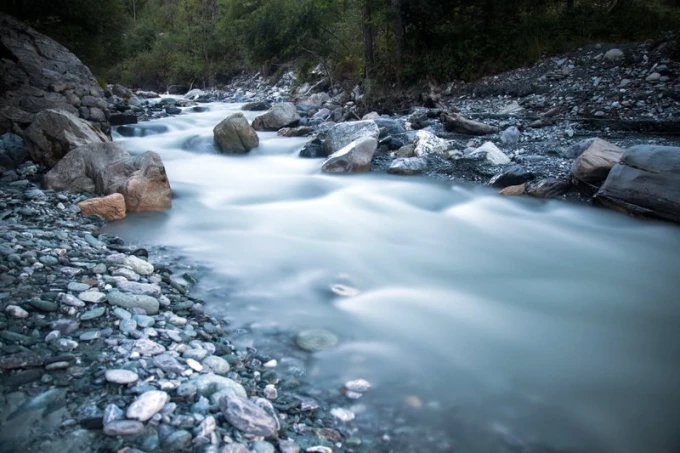 Wall mural magical river FP 1663 - Graphic design. River with stones surrounded by greenery, flowing water.