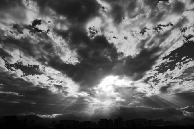 Wall mural of sunlight breaking through clouds FP 1748 - Graphic design. Clouds in various shades of gray.