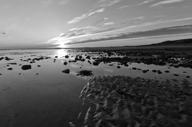 Wall mural of a sunset over the ocean FP 1831 - Graphic design. The image depicts a sunset above the shoreline.