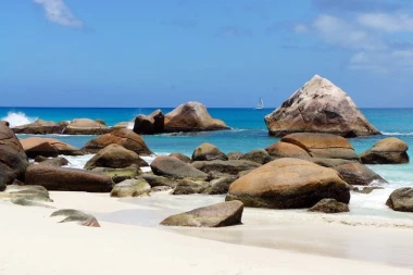 Wall mural of picturesque beach rocks FP 1901 - Graphic design featuring uniquely shaped rocks against blue water.