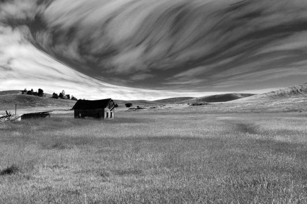 Wall mural of a fairy-tale sky over a meadow FP 2008 - Graphic design with clouds in various shapes against mountains.