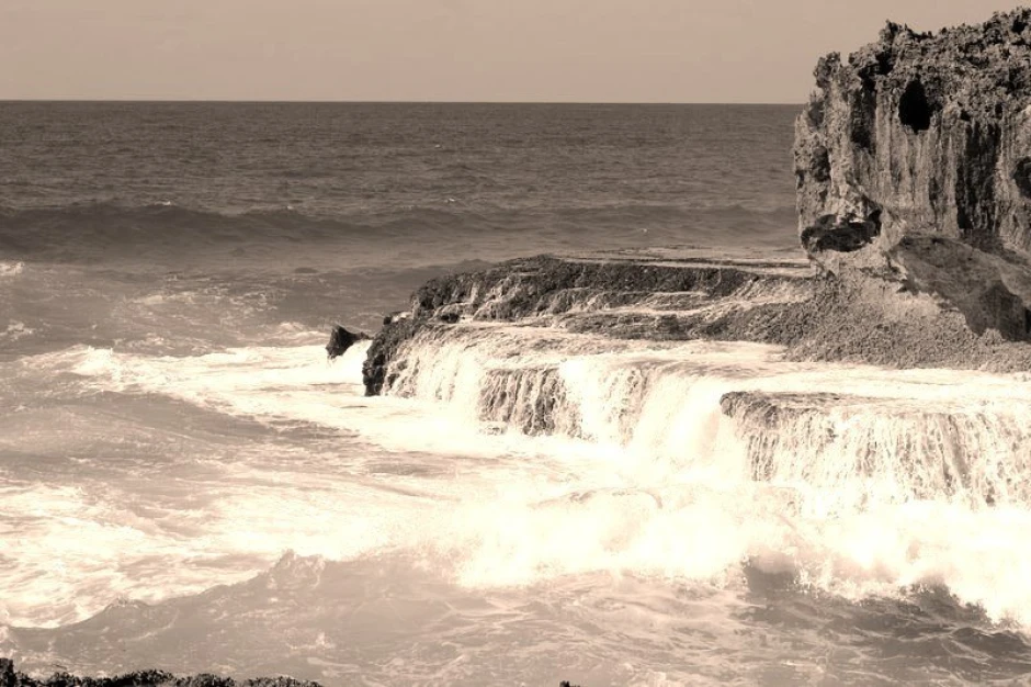 Azure water wallpaper with flowing water over rocks, featuring a dynamic design with light and dark tones.
