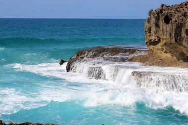 Azure water wallpaper with cascading rocks FP 2023 - Graphic design. Water waves in shades of blue.