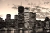 Cityscape evening wallpaper FP 2135 - Graphic design featuring silhouettes of tall buildings with lights and clouds.