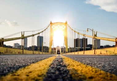 Golden Gate Bridge wall mural FP 2128 - Graphic design with yellow elements, cityscape, and sun in the background.