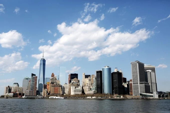 Wall mural of stunning New York FP 2166 - Graphic design featuring a city skyline with skyscrapers and clouds.