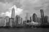 Cityscape wallpaper from a ship FP 2269 - Graphic design. Gray buildings in various shapes against a cloud backdrop.