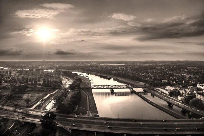 Sunset wall mural FP 2258 - Graphic design featuring a landscape with a river, bridge, and city in the background.