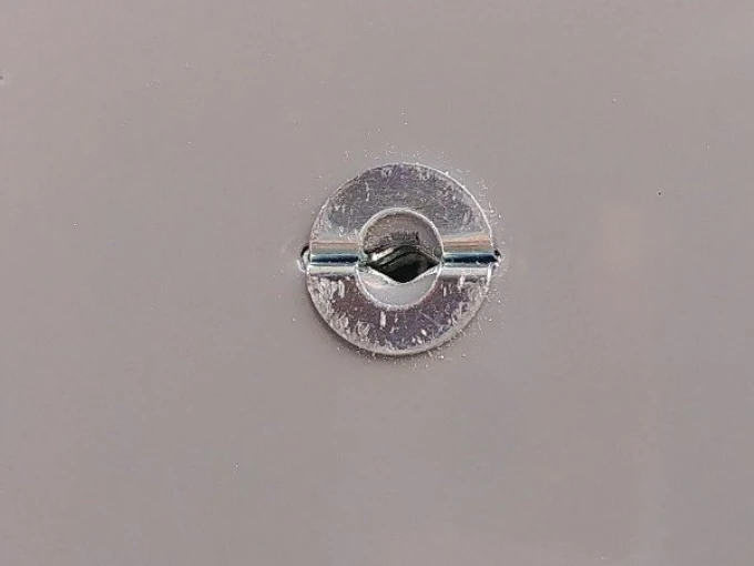 Gypsum board mounting system - Graphic pattern. Round metal element with a center hole.