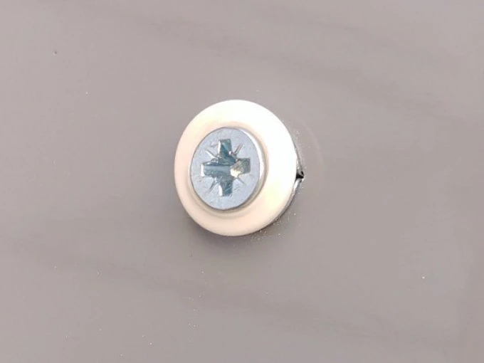 Gypsum board mounting system - Graphic design. Round element with white cover and blue screw.