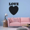 Chalk heart sticker 234 - Living room setup with light walls, pink sofa, and wooden table.