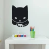 Chalk sticker for kids featuring a black cat with big eyes holding a pencil.